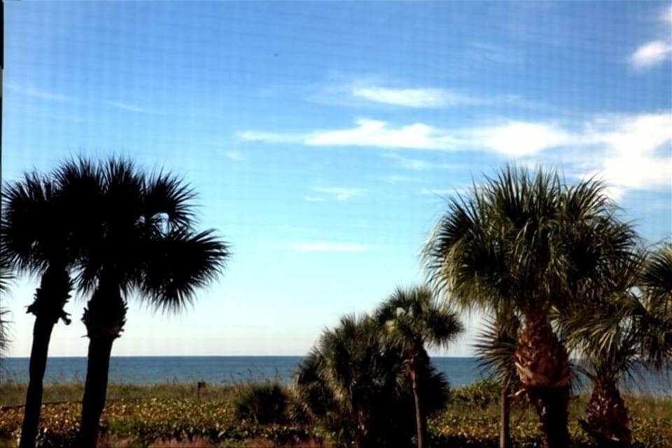 Ocean view from balcony with porch swing and looking out bedrooms, too.
