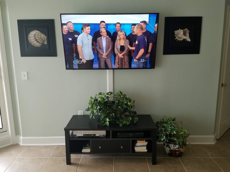Living room TV with soundbar.