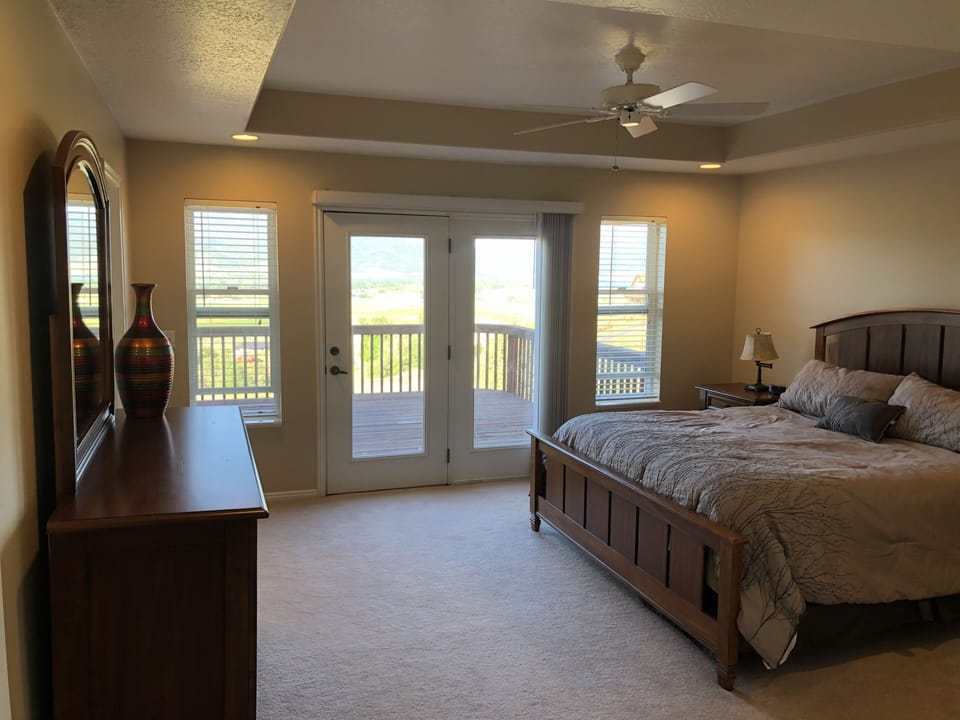 The master bedroom has a king bed, soaking tub, shower, and great views!