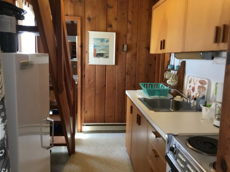 Galley kitchen and door to first floor bathroom