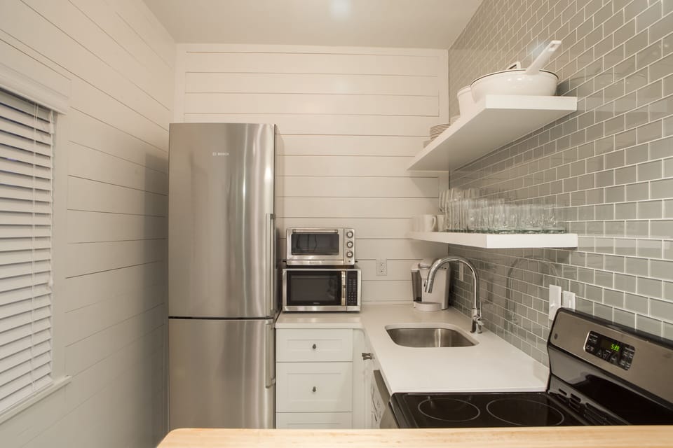 Upstairs kitchen with the finest appliances.