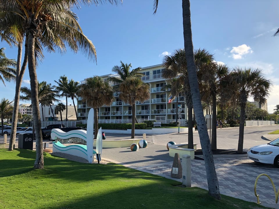 View of the building from behind the iconic Deerfield Beach sign.