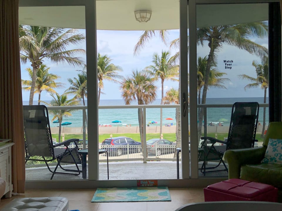 Your view of the beach while relaxing in this beautifully renovated condo.