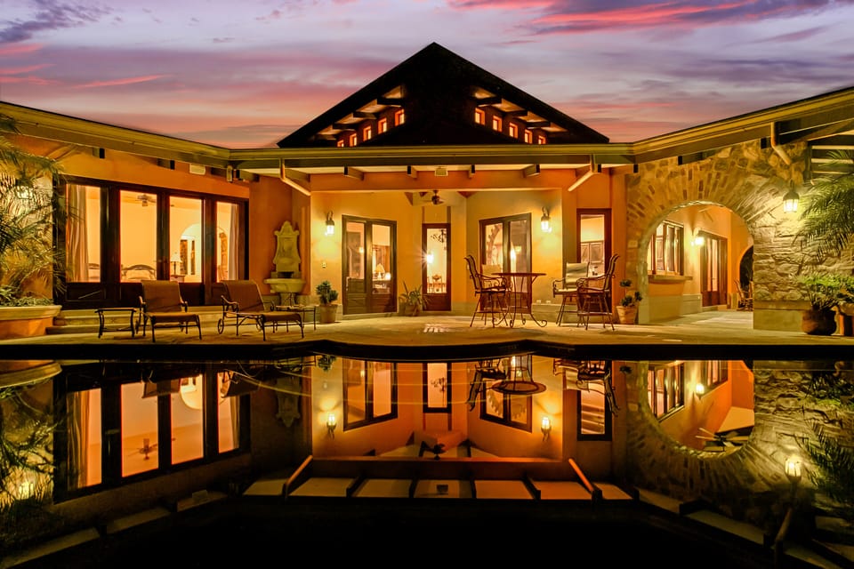 CASA ANTIGUA FROM THE INFINITY EDGE POOL AT NIGHT 