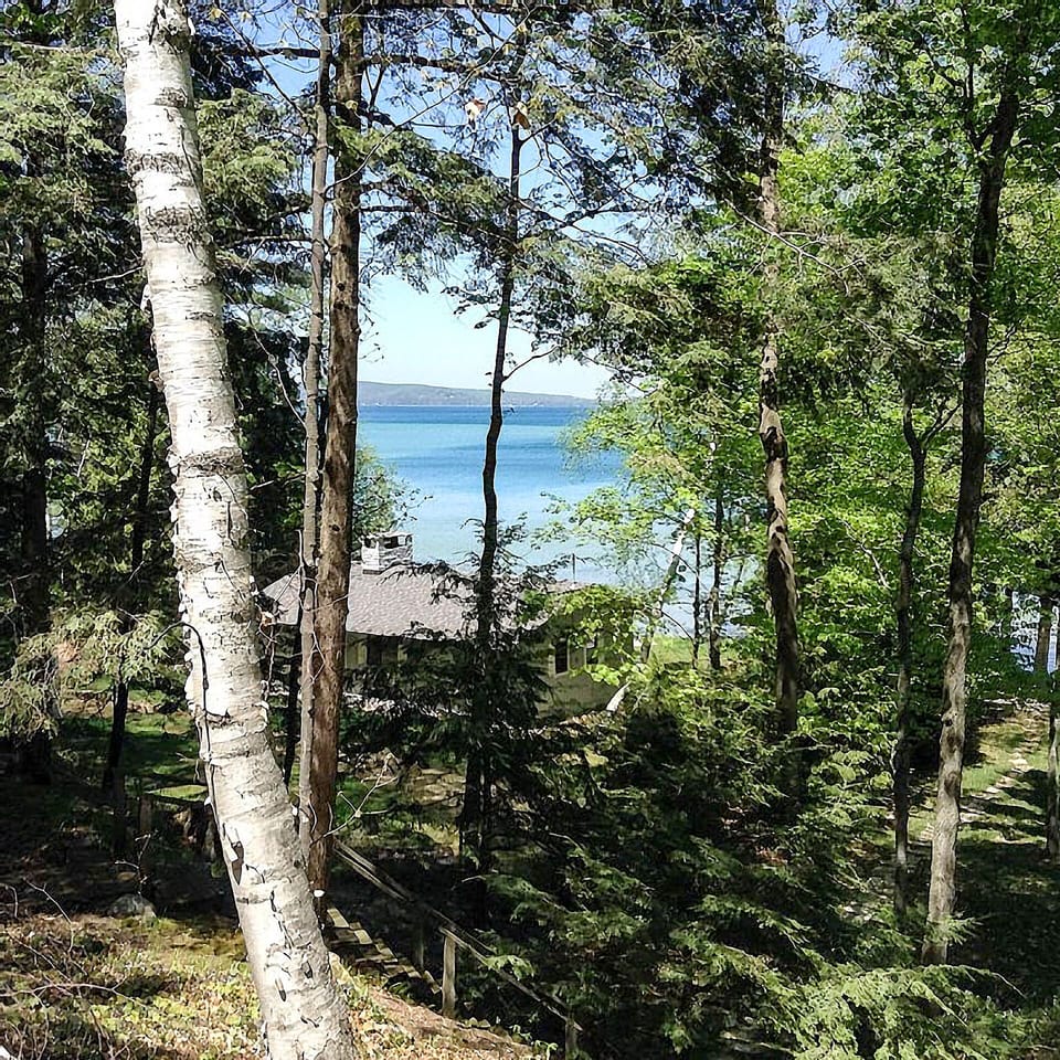 View of sandbar location looking across roof of cottage below