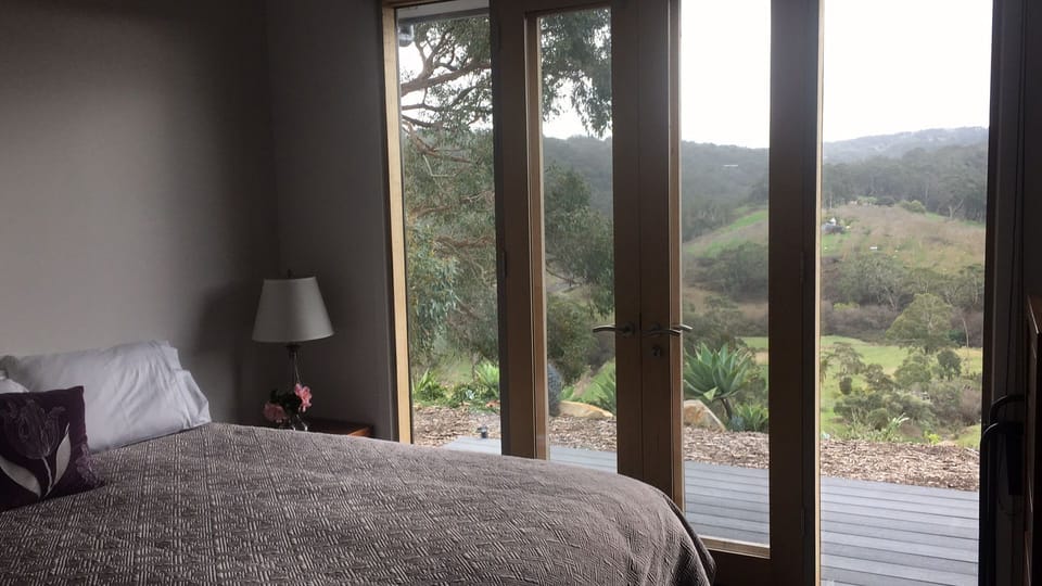 French doors with secured screens allow summer airflow and direct access to deck