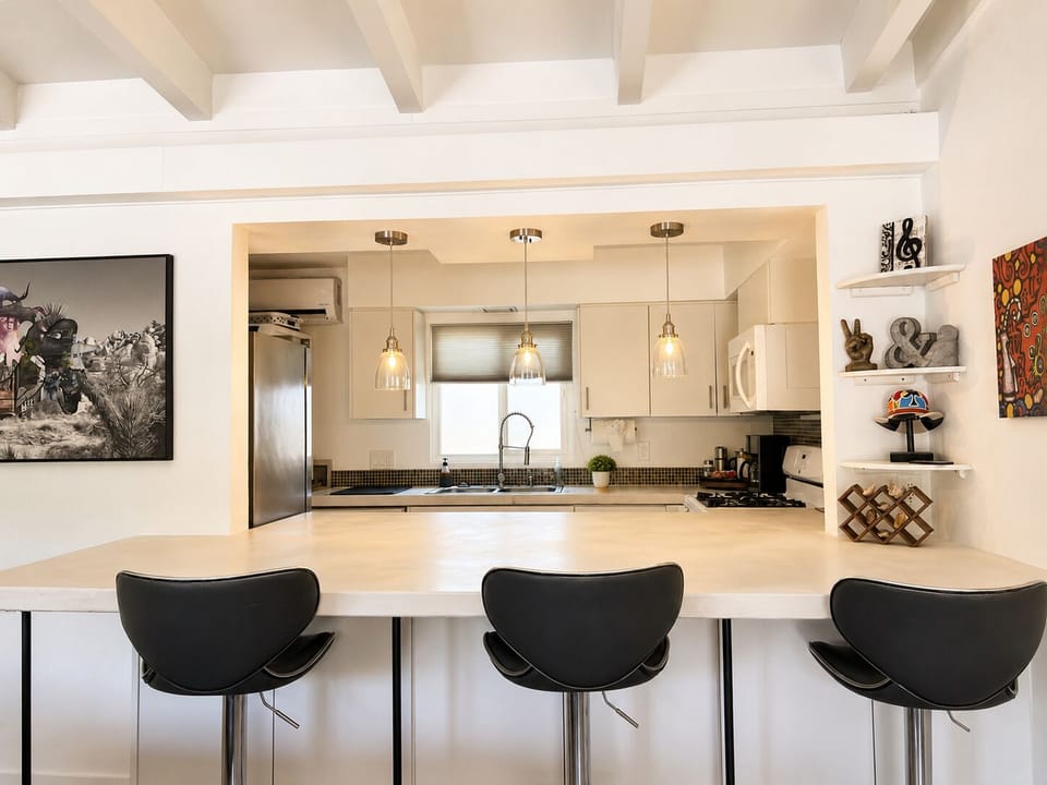 Sleek island seating perfect for a quick breakfast, a casual drink, or casual workspace.