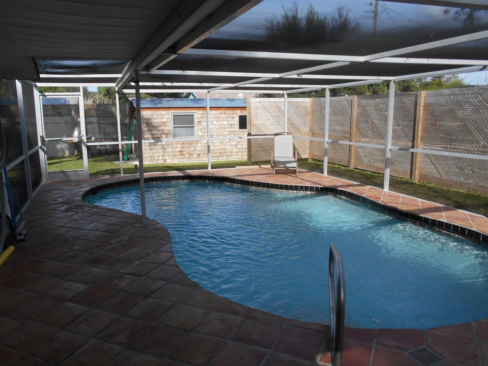 A Sliding Glass Door connects the Master Bedroom to the Pool