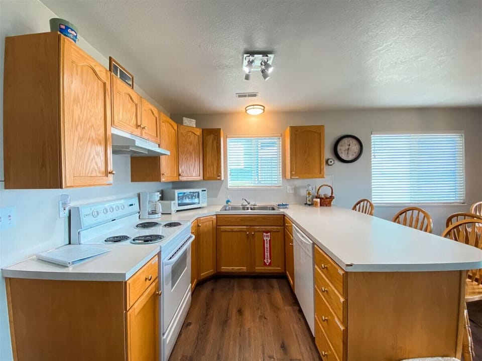 Open kitchen with bar seating and modern appliances