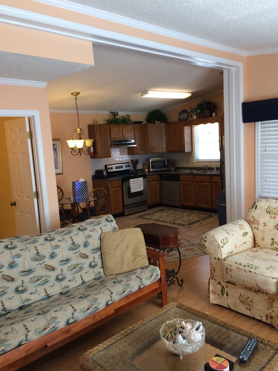 View of den and full kitchen.