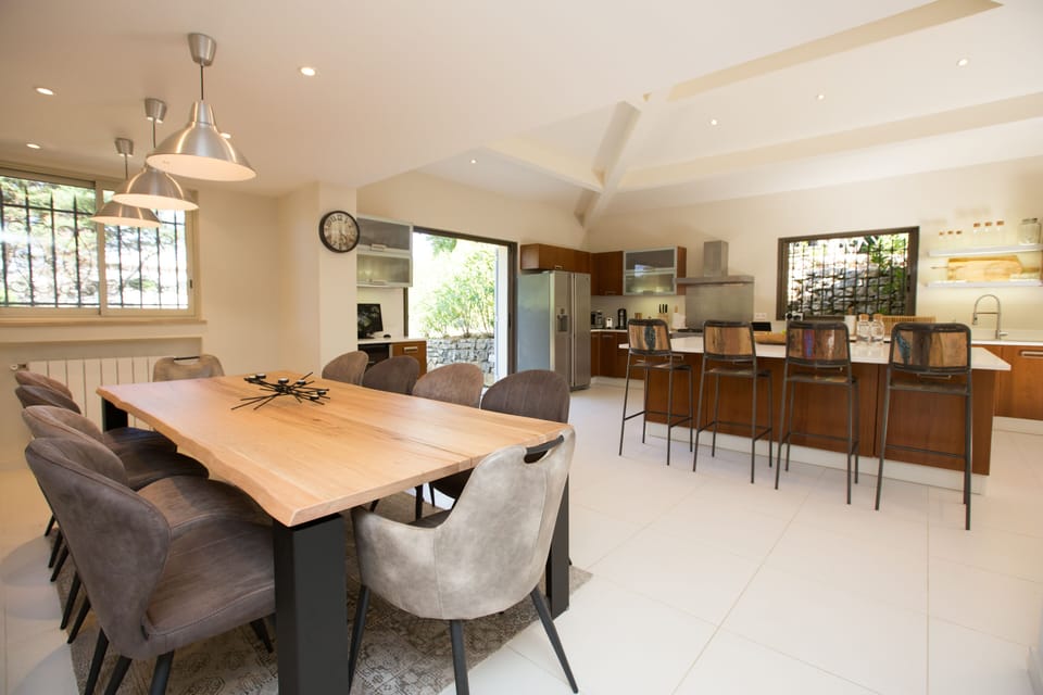 Italian-made Devina Nais solid dining table for 10. Nespresso and wine fridge.