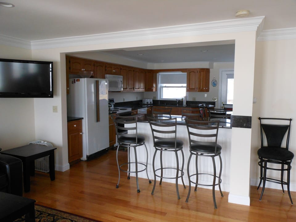 You enter the home into the fully-equipped kitchen. 