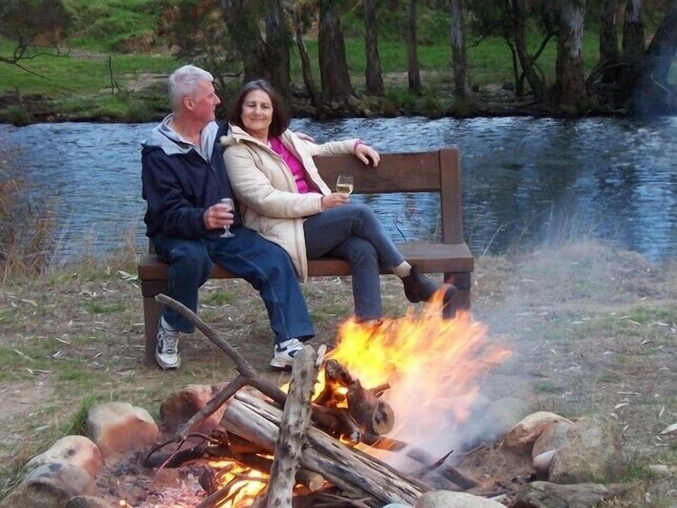 Enjoying a campfire by the river