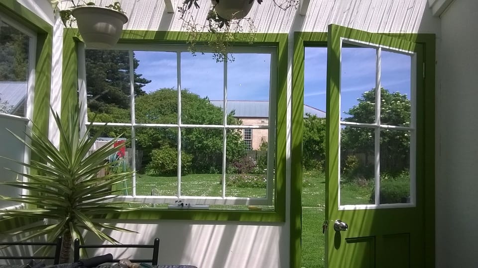 The Conservatory looks over the rear garden towards Old St Andrews.