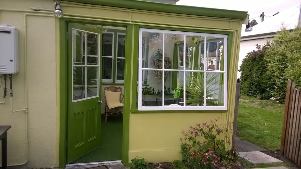 Rear entrance to cottage from the drive via the conservatory. 