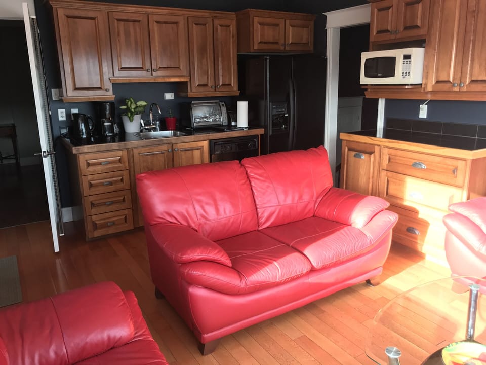 Kitchen,  door to second bedroom. Access to Deck. 
