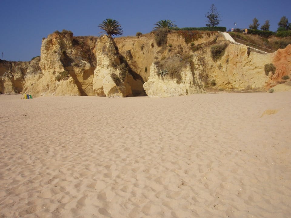 Long sandy beach with beach restaurants