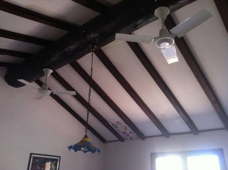 Ceiling fans - efficient in cooling down the whole kitchen and living area