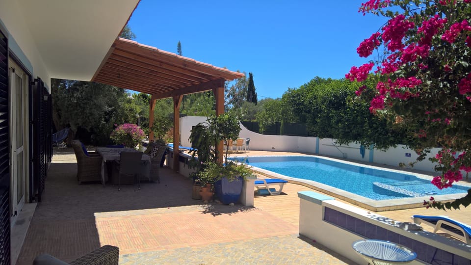 Outdoor dining terrace and swimming pool