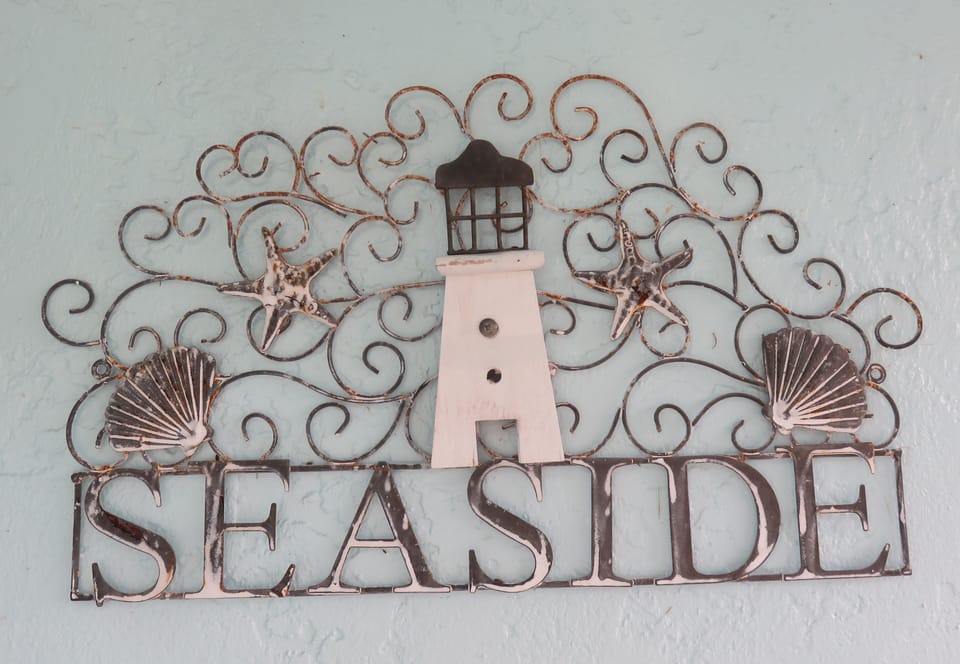 Welcome to our home.  Front porch decor sets the tone for a relaxing stay.