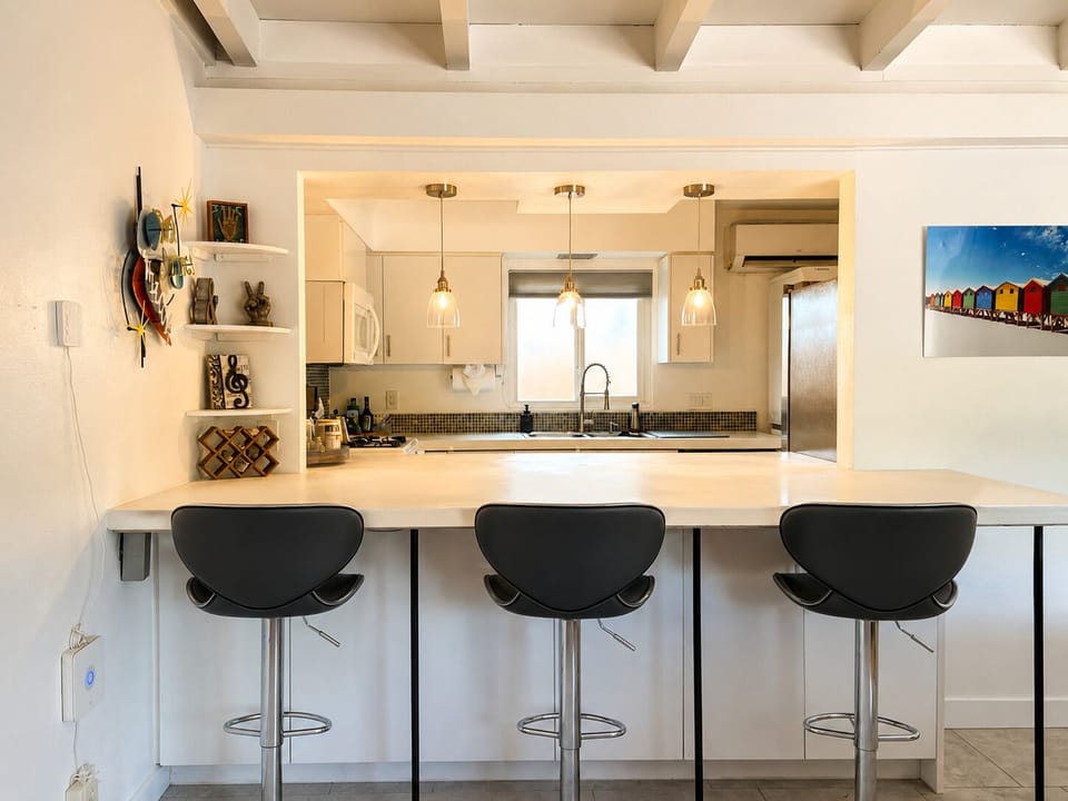 Sleek island seating perfect for a quick breakfast, a casual drink, or casual workspace.