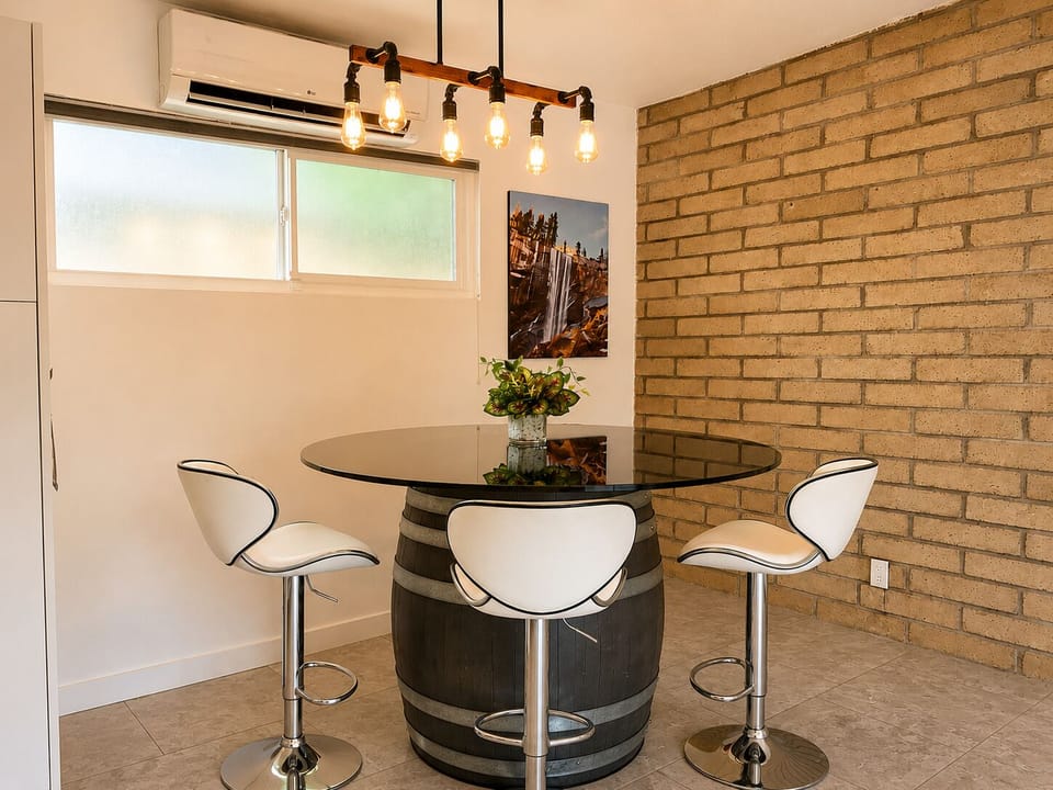 Enjoy meals or log some work hours at the comfortable dining table right off the kitchen.