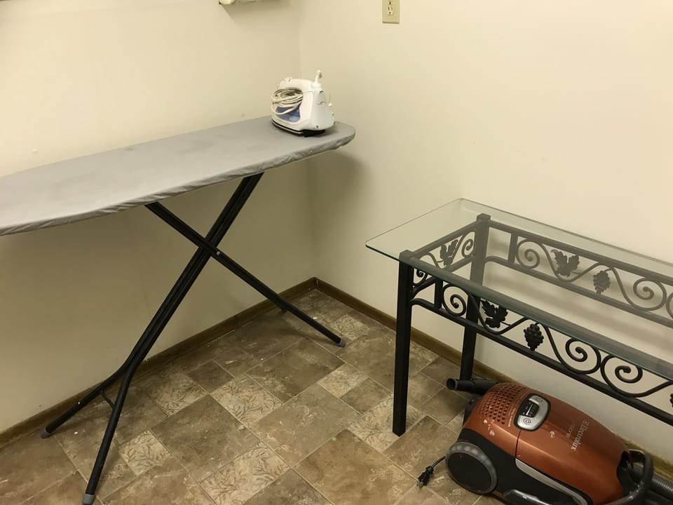 Ironing board and Vaccum provided