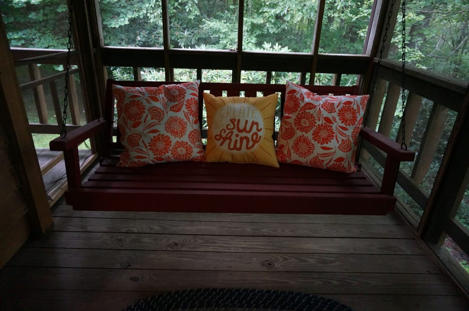 Screened back porch overlooks the pond
