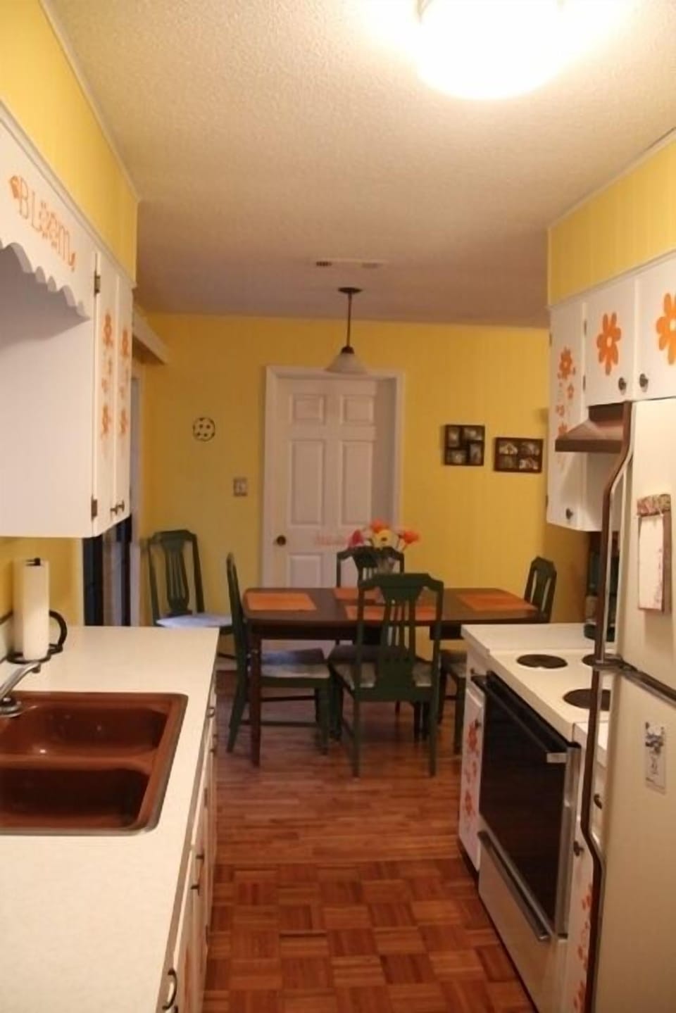 Kitchen to Dining Room, door to Laundry Room that opens up to Carport.
