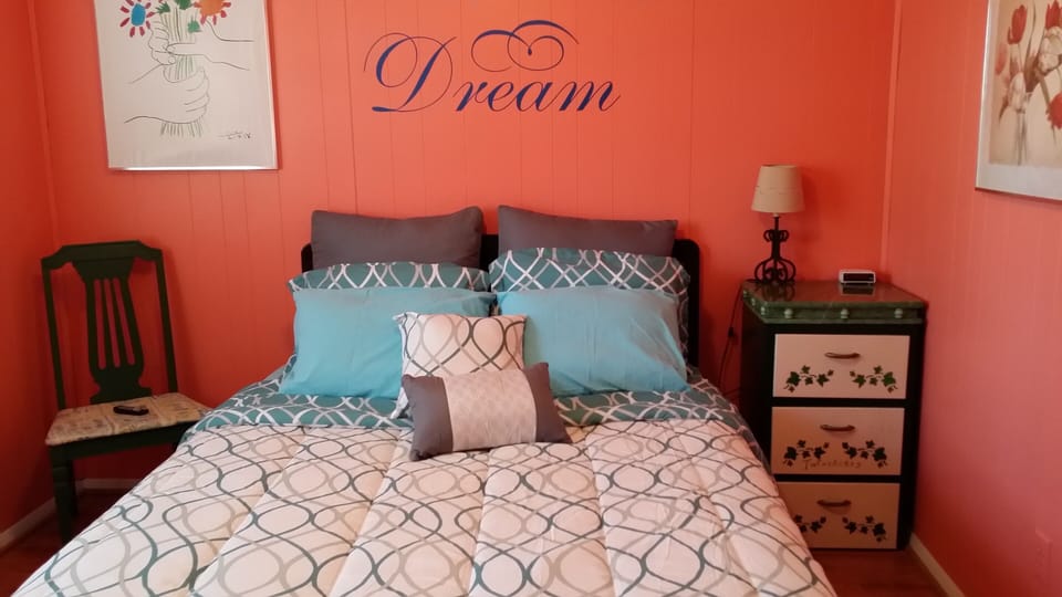 Coral Room Queen Bed overlooks front yard
