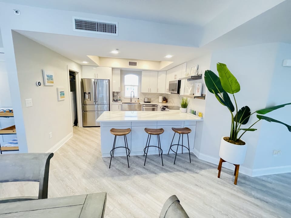Light and bright kitchen with breakfast bar seating