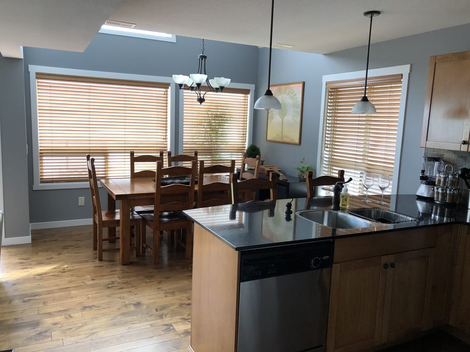 Well equipped kitchen and dining area with child's highchair