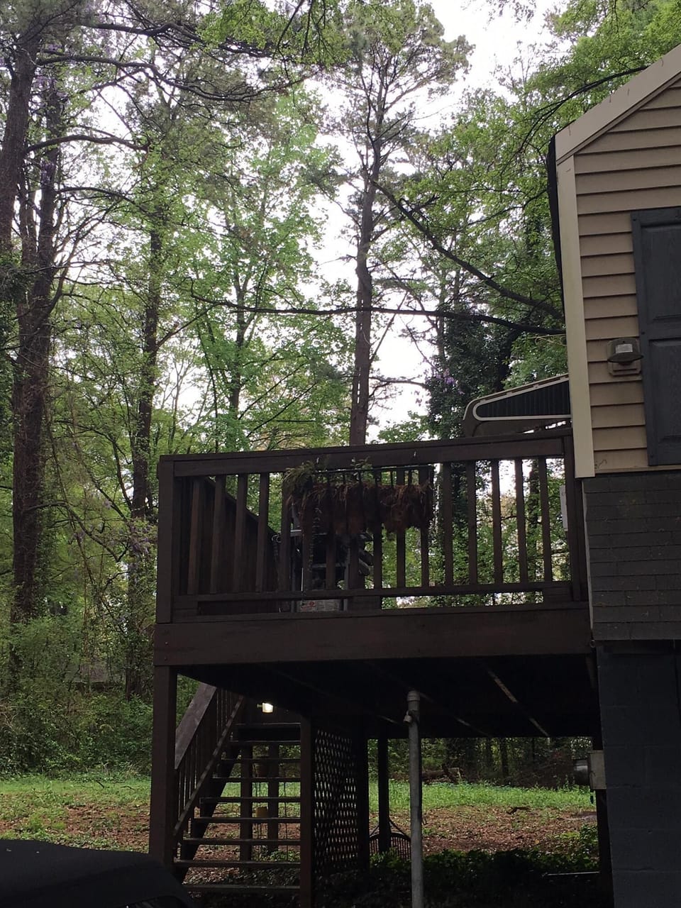 Large deck with BBQ and outdoor seating for four.