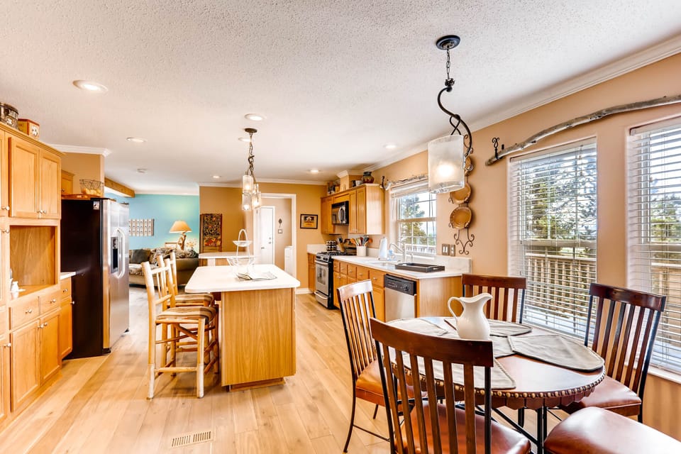 This magnificent kitchen and dining room were just remodeled with beautiful marble counter tops, new paint and much more.