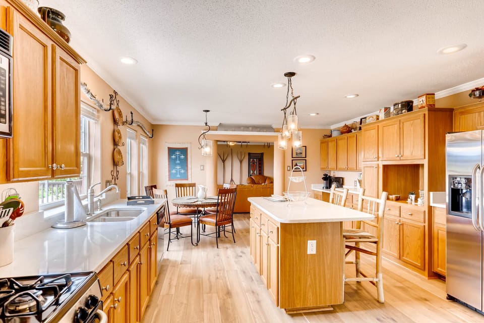 The kitchen is spacious and has a dining room as well as additional seating at the island.