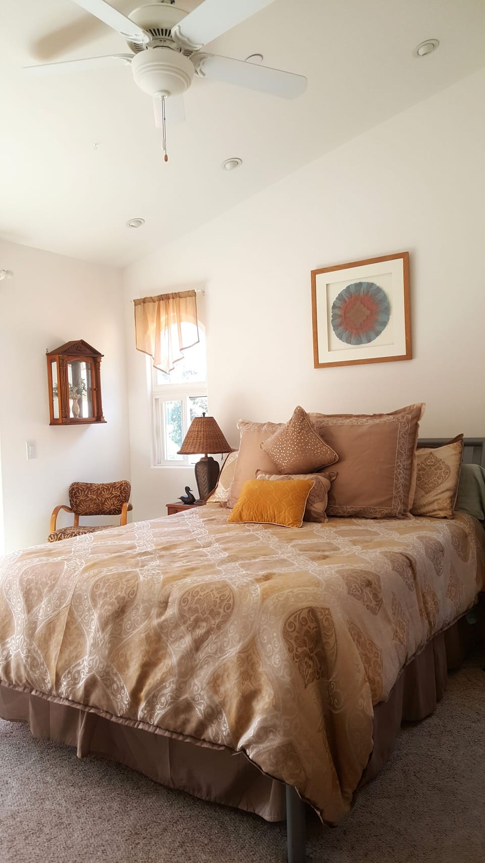 Large bedroom with CA Queen memory foam bed and lots of pillows