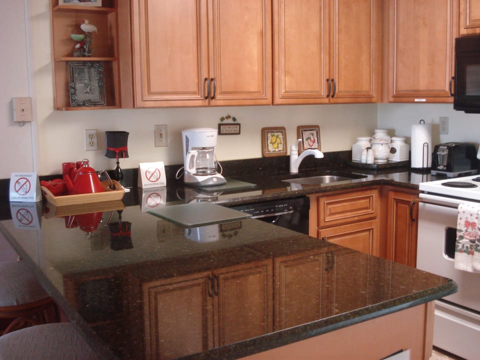 Beautiful granite counter tops and a fully equipped kitchen.