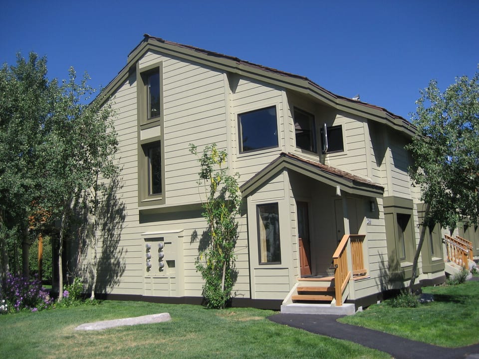 Front door area with large grass area, south facing so lots of light!