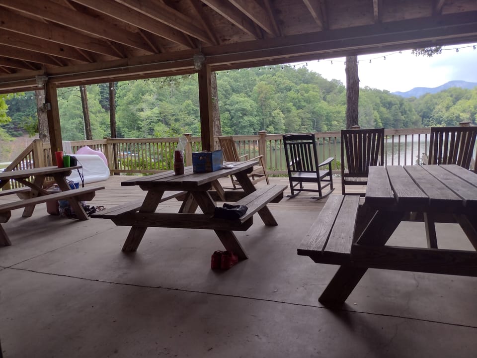 Covered picnic area over looking lake and beach in the community.