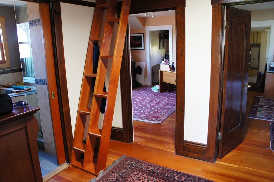 Upstairs landing, entry to shared bathroom, Japanese stairs to the sleeping loft