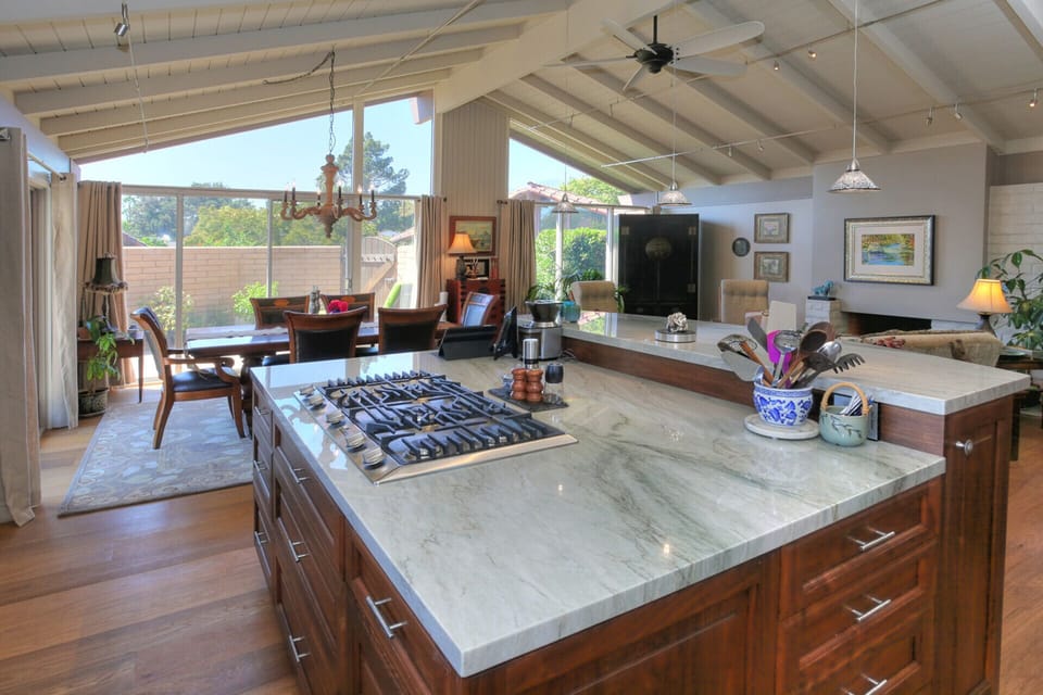 Spacious open floor plan, custom walnut cabinets, LED lighting, solid oak floors