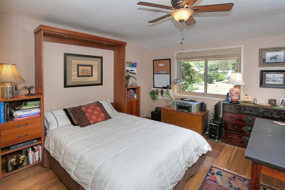 Custom built queen size murphy bed in guest bedroom/office 