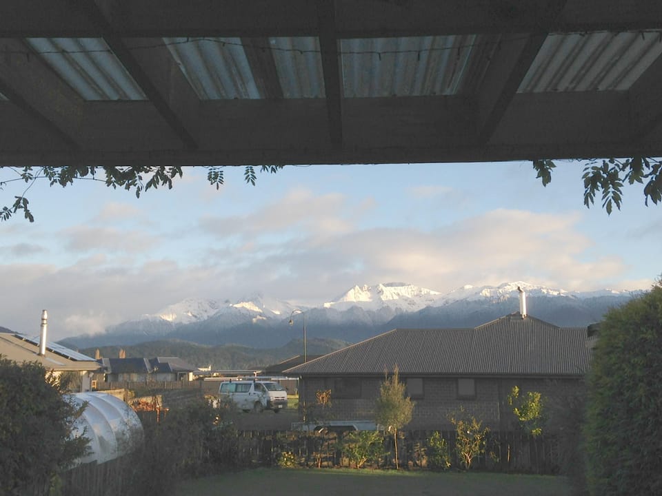 Snow on Murchison Mountains viewed from deck
