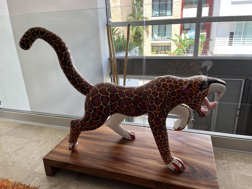 wood carved hand painted one of kind Jaguar.  
