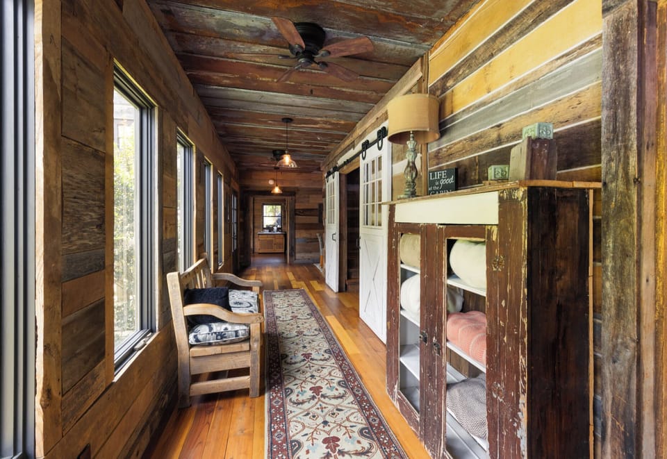 Main lodge View of the master addition hallway as viewed from the back door to the rear porch and bunkhouse