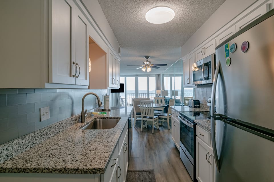 Galley kitchen as you enter the unit from the front door