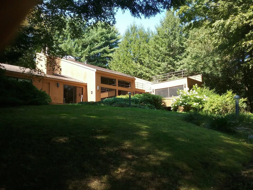 Lakeside of house, looking up from boathouse