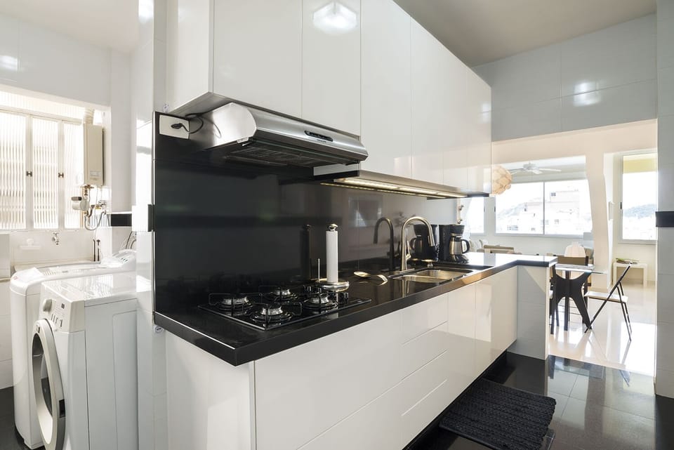 Kitchen Area and Utility Room With Washer and Dryer