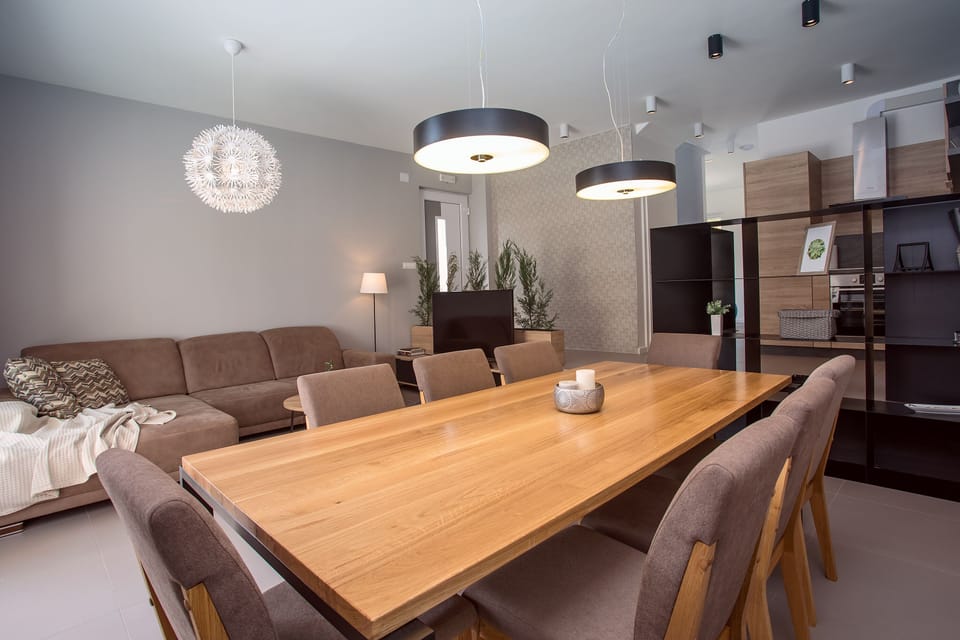 Modern dining and living area in front of Mthe beautiful outdoor area