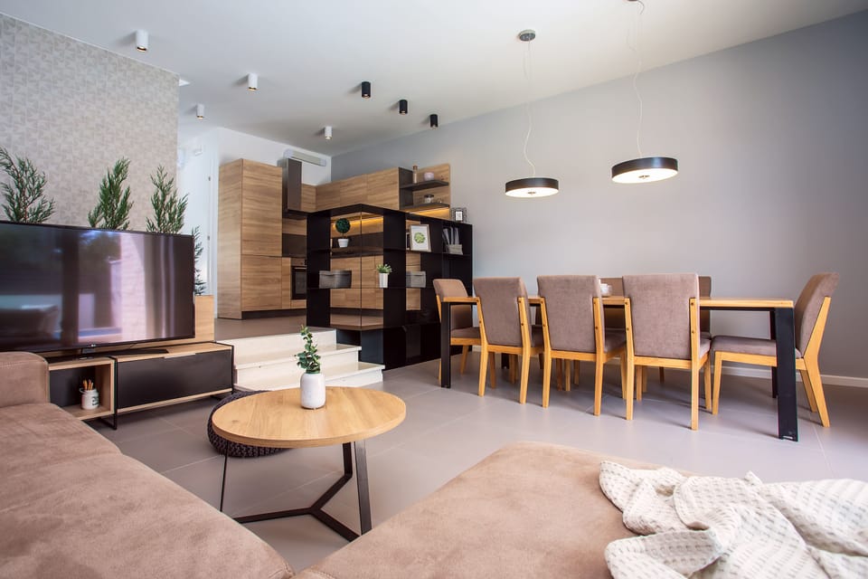 Modern dining and living area in front of the beautiful outdoor area